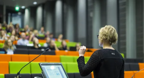 Lecturer speaking in lecture hall