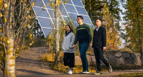 International students walking in park at LUT University campus