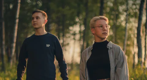LUT University students walking in the woods at sunset