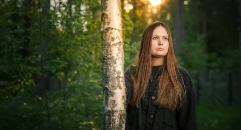 LUT University student walking in forest