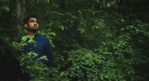 LUT University student walking in the forest