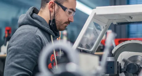 LUT Students in JHC usin a lathe