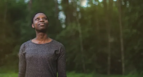 LUT University student in the forest at sunset