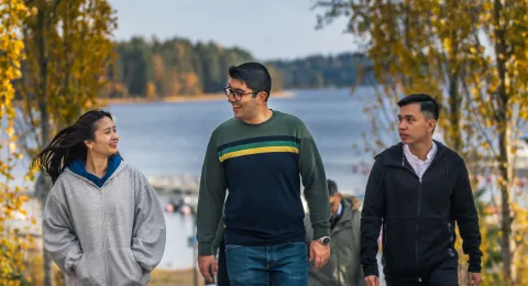 LUT University international students walking at lakeside