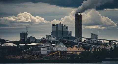 Smoke coming from chimneys in a factory area