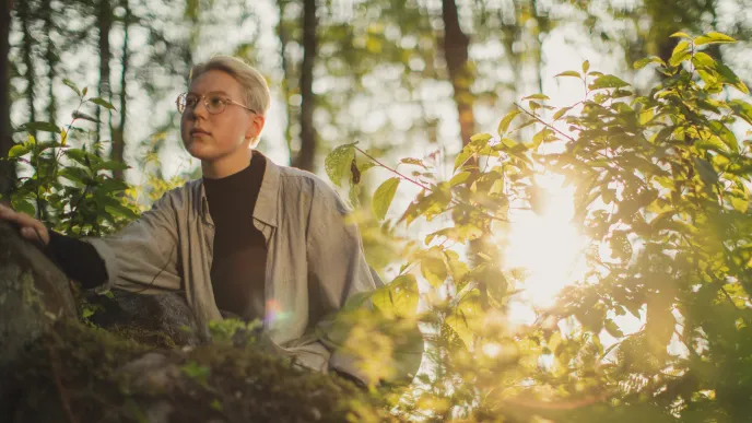 LUT University master&#039;s student in a forest at sunset