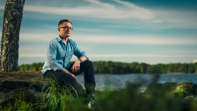 LUT University master&#039;s student sitting at the shore