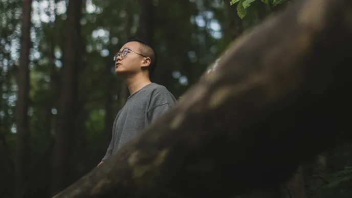 LUT University student in the woods looking at the sky