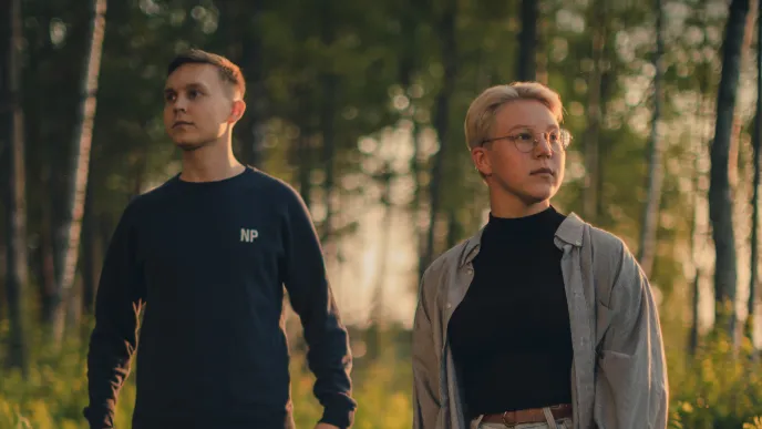 LUT University students walking in the woods at sunset