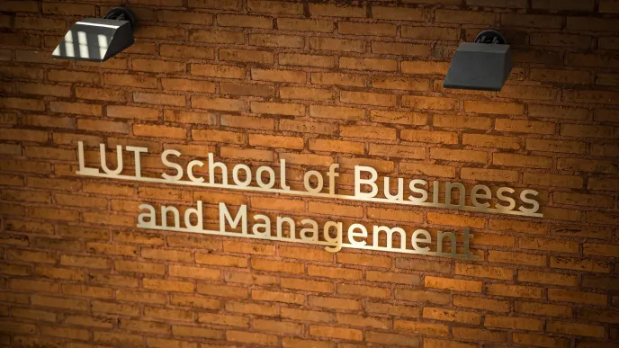 LUT School of Business and Management logo on a brick wall