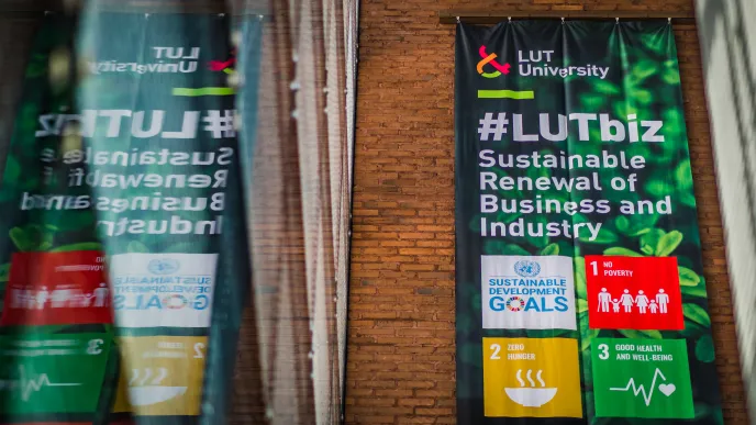 SDG values poster reflected from window in LUT School of Business and Management