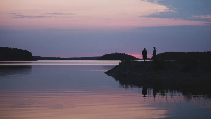 Students in sunset dock at lake Saimaa in LUT University