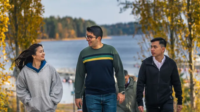 LUT University international students walking at lakeside