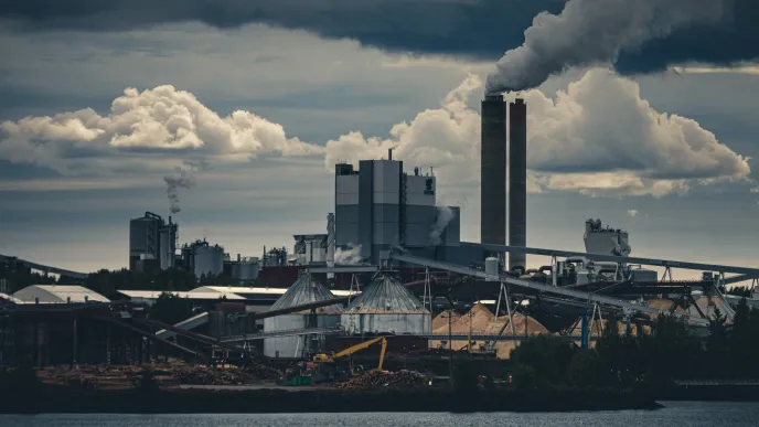 Smoke coming from chimneys in a factory area