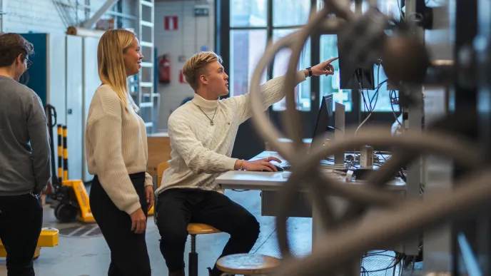 Students on campus in energy technology laboratories