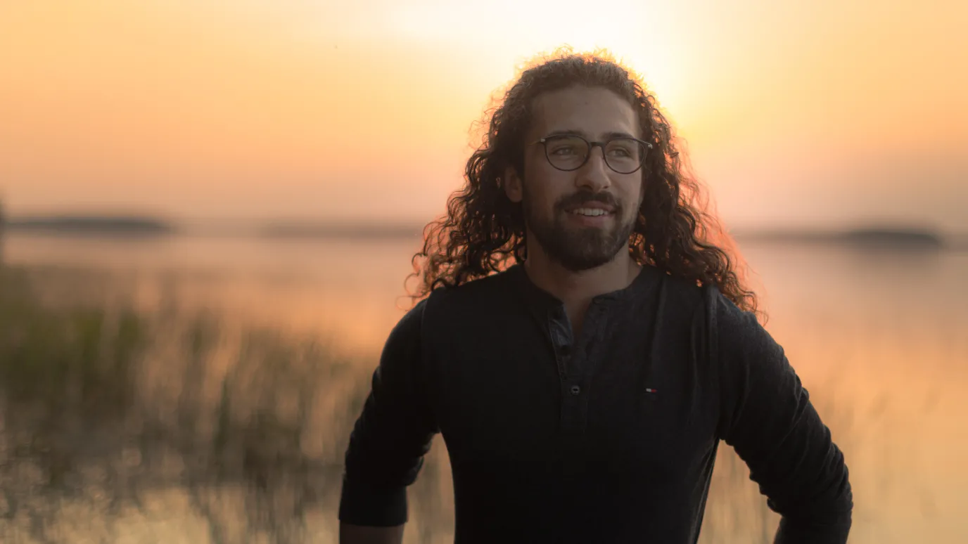 LUT University student on the shore at sunset