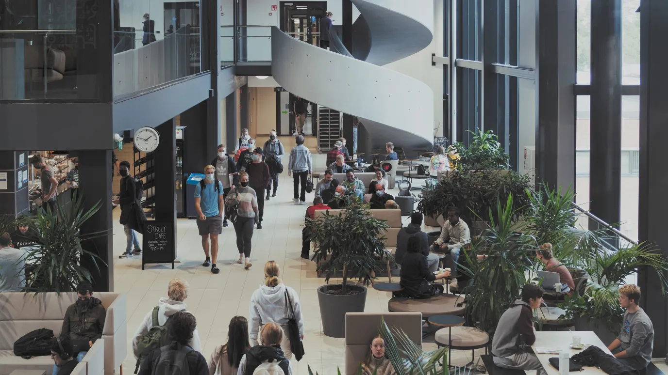 Student and university staff in Street Cafe at LUT campus