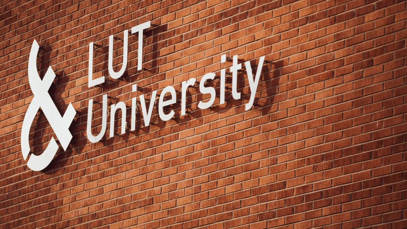 LUT University logo on a brick wall 