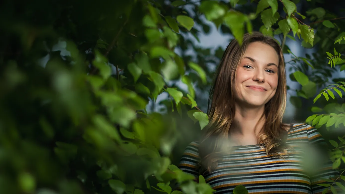 a woman is smiling in the middle of the picture